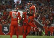 Nov 3, 2016; Tampa, FL, USA; Tampa Bay Buccaneers defensive tackle Gerald McCoy (93) is congratulated by outside linebacker Lavonte David (54) after he sacked Atlanta Falcons quarterback Matt Ryan (2) (not pictured) during the first half at Raymond James Stadium. Mandatory Credit: Kim Klement-USA TODAY Sports