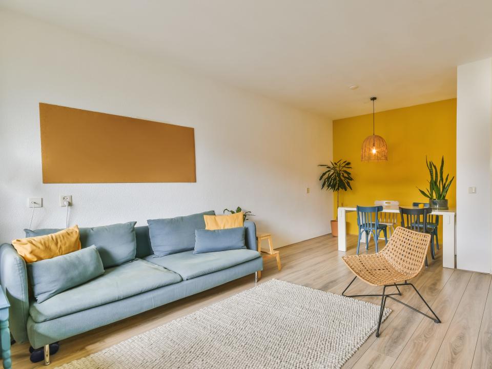 living room with yellow accent wall
