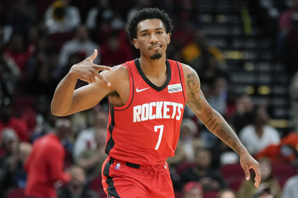 Houston Rockets guard Armoni Brooks (7) reacts after making a three point basket during the first half of an NBA basketball game against the Charlotte Hornets, Saturday, Nov. 27, 2021, in Houston. (AP Photo/Eric Christian Smith)