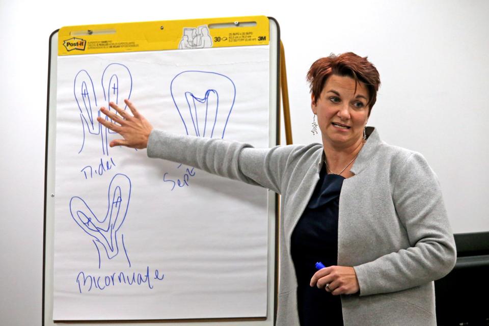 Dr. Colleen McNicholas, chief medical officer at Planned Parenthood, answers questions by Planned Parenthood attorney Richard Muniz on the third day of hearings between Planned Parenthood and Missouri Department of Health and Senior Services on whether Planned Parenthood can keep its abortion license on Wednesday, Oct. 30, 2019, in St. Louis. (Laurie Skrivan/St. Louis Post-Dispatch via AP)