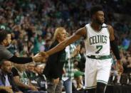 Apr 30, 2017; Boston, MA, USA; Boston Celtics forward Jaylen Brown (7) slaps hands with a fan during the second half of the Boston Celtics 123-111 win over the Washington Wizards in game one of the second round of the 2017 NBA Playoffs at TD Garden. Mandatory Credit: Winslow Townson-USA TODAY Sports