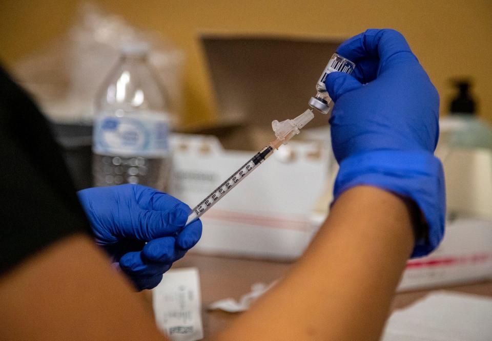 Certified medical assistant Yvette Garcia draws a dose of the monkeypox vaccine for a patient at DAP Health in Palm Springs, Calif., Saturday, Sept. 10, 2022. 