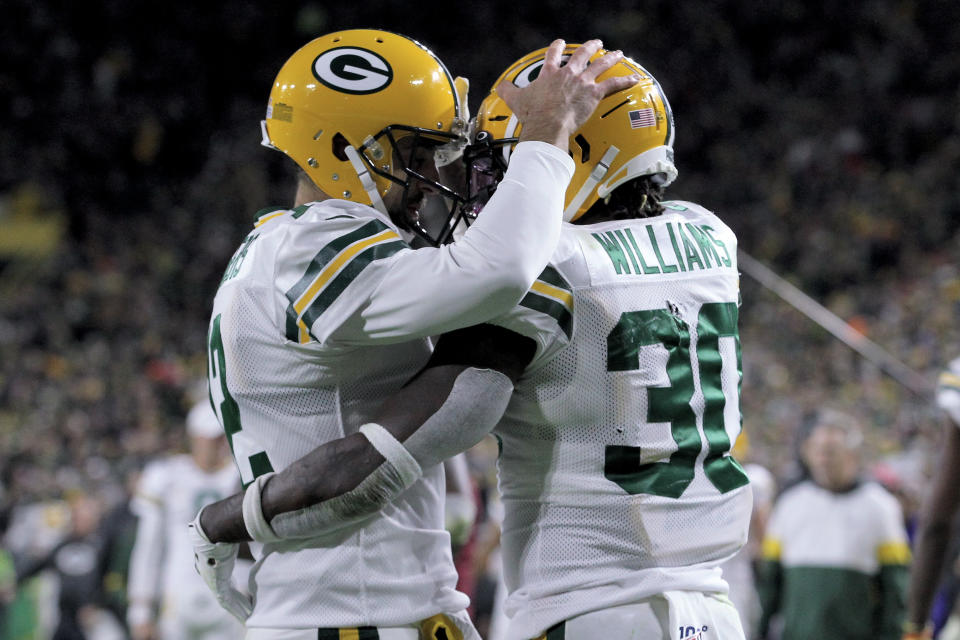 Aaron Rodgers and Jamaal Williams celebrate after a touchdown against the Lions. (Getty Images)