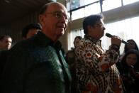 U.S. Commerce Secretary Wilbur Ross reacts as Indonesia's Chief Economic Minister Airlangga Hartarto talks to journalists during a press briefing after their meeting in Jakarta