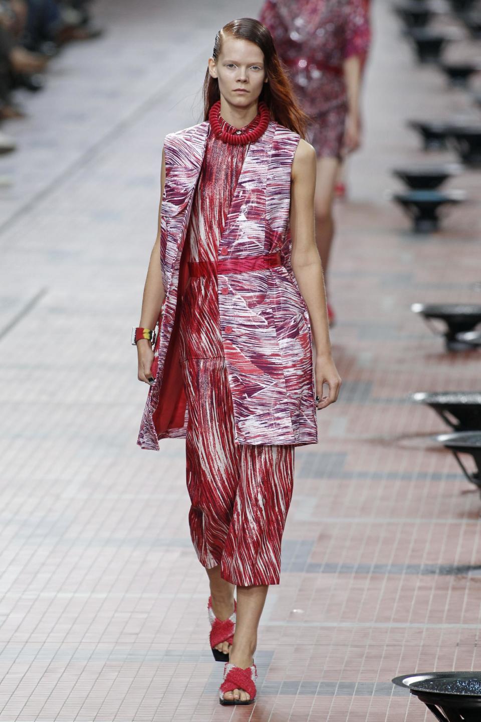 A model presents a creation as part of Kenzo's ready-to-wear Spring/Summer 2014 fashion collection, presented Sunday, Sept. 29, 2013 in Paris. (AP Photo/Thibault Camus)