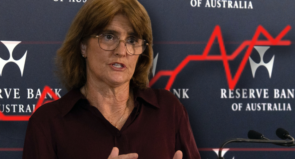 RBA governor Michele Bullock with a graph showing rising unemployment rate behind her