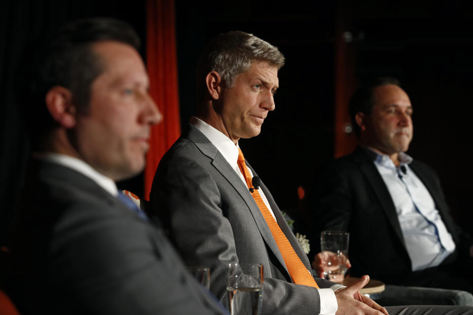 Mike Elias, center, the Baltimore Orioles' new executive vice president and general manager, attends a baseball news conference alongside Orioles ownership representative Louis Angelos, front left, and executive vice president John Angelos, Monday, Nov. 19, 2018, in Baltimore. (AP Photo/Patrick Semansky)