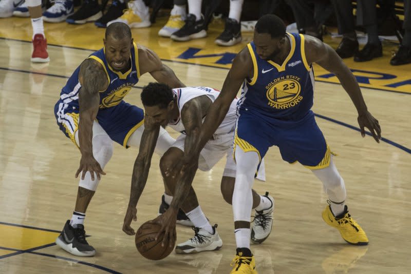 Former Golden State Warriors guard/forward Andre Iguodala (L) was a two-time All-Defensive Team selection. File Photo by Terry Schmitt/UPI