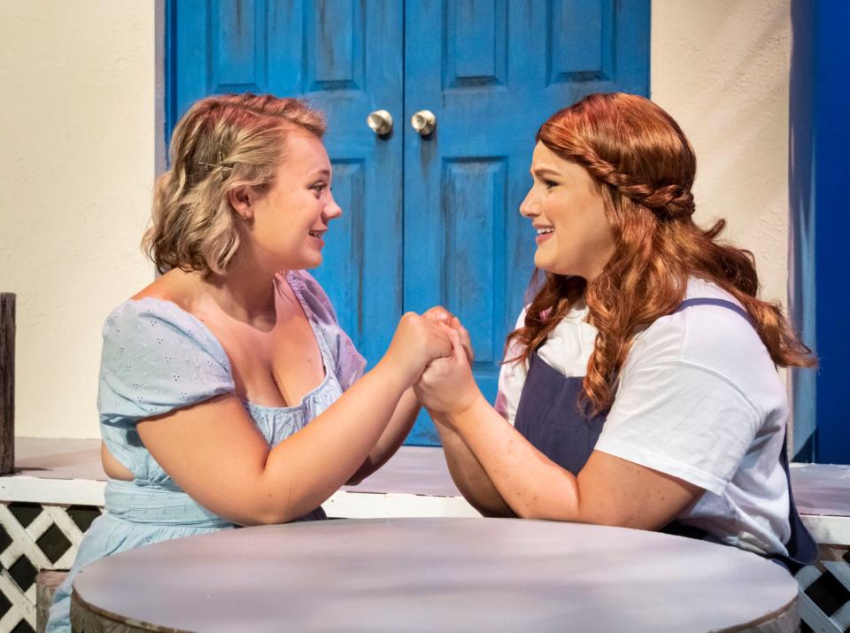 Reagan Branch (left) and Jamie Shannon Ferguson Ertle in Theatre Tuscaloosa's production of "Mamma Mia!," running Friday through July 24 in the Bean-Brown Theatre. [Photo by Porfirio Solórzano]