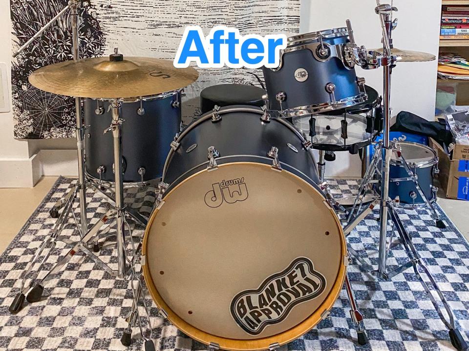 Blue text says "after" at the top of a photo of a blue slate drum kit on a checkered blue rug