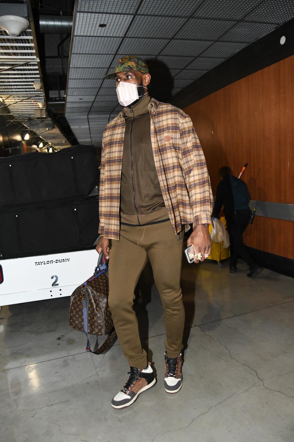 LeBron James of the Lakers arrives for a game against the Minnesota Timberwolves in Los Angeles, December 27, 2020.