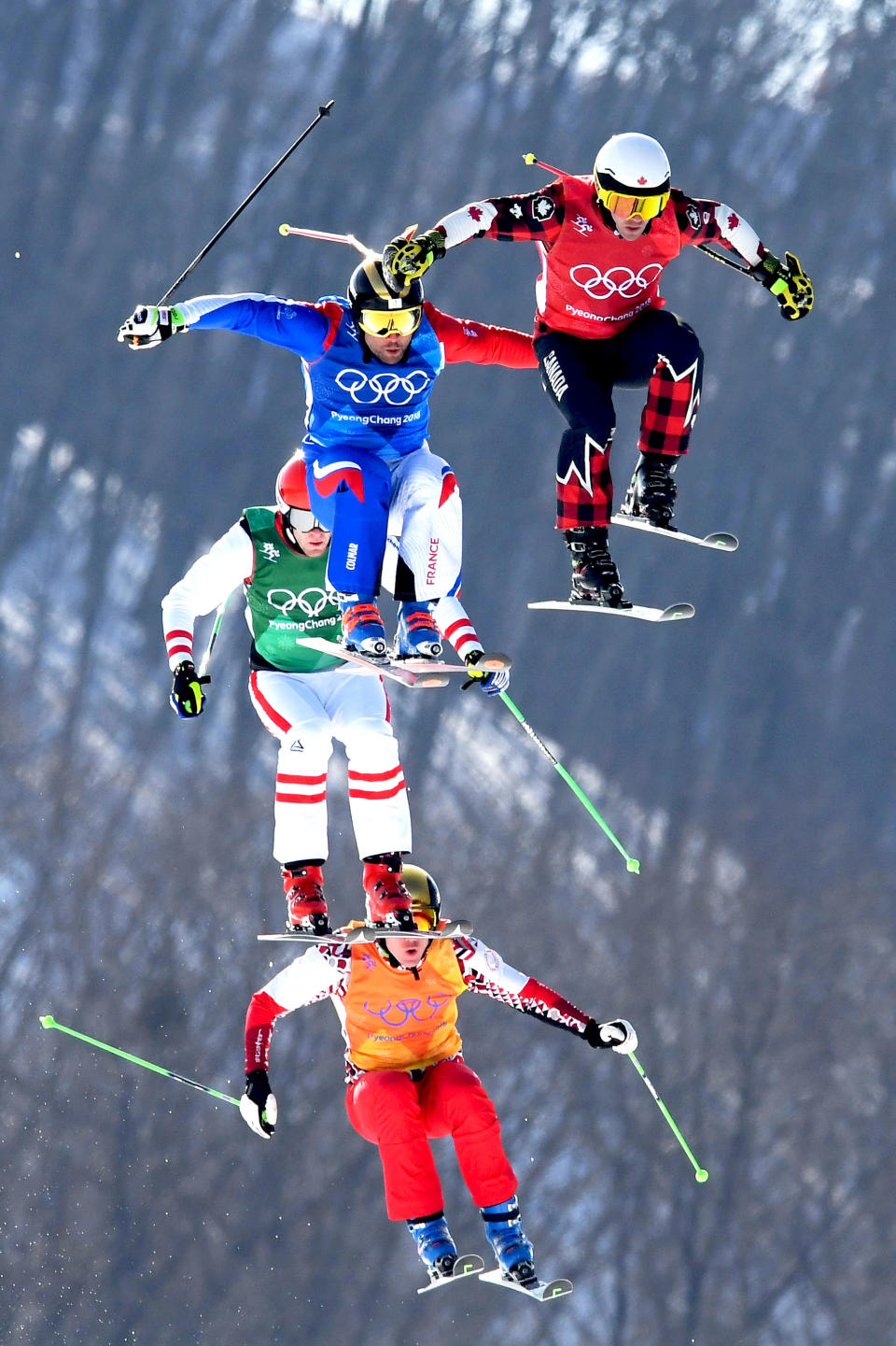 <p>Canada’s Kevin Drury, France’s Arnaud Bovolenta, OAR’s Semem Denishchikov, and Austria’s Robert Winkler compete in the Freestyle Skiing Men’s Ski Cross Quarterfinals on day 12 of the PyeongChang 2018 Winter Olympic Games in Pyeongchang, South Korea, February 21, 2018.<br> (Photo by Quinn Rooney/Getty Images) </p>