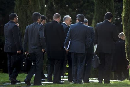 Head of Iranian Atomic Energy Organisation Ali Akbar Salehi (C) walks with others before a day of meetings at the Beau Rivage Palace Hotel on March 27, 2015 in Lausanne. REUTERS/Brendan Smialowski/Pool