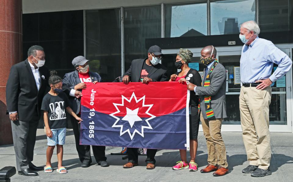 A special ceremony was held in front of the City of Milwaukee building at 841 North Broadway on June 19, 2020. It's the first time the Juneteenth flag was raised over a Milwaukee city government building.