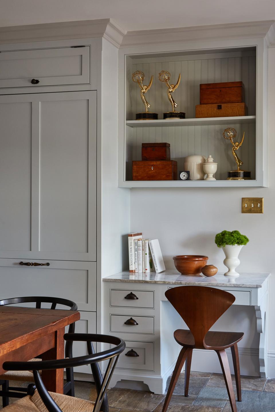 “Their request was, ‘Please don’t put these on a bookshelf in the living room,’” says Martin of the couple’s collective Emmy awards, which casually reside in the kitchen. They also use this space to display their daugher’s academic certificates and camp awards. “They’re just as important as the Emmys,” Tony says.