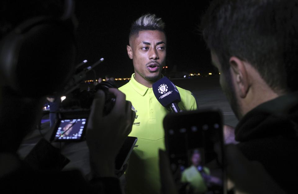 Bruno Henrique of Brazil's Flamengo talks to the press after arriving at the military airport Grupo Aereo 8, in Lima, Peru, Wednesday, Nov. 20, 2019. The team will play Argentina's River Plate on Saturday's Copa Libertadores final. (AP Photo/Martin Mejia)