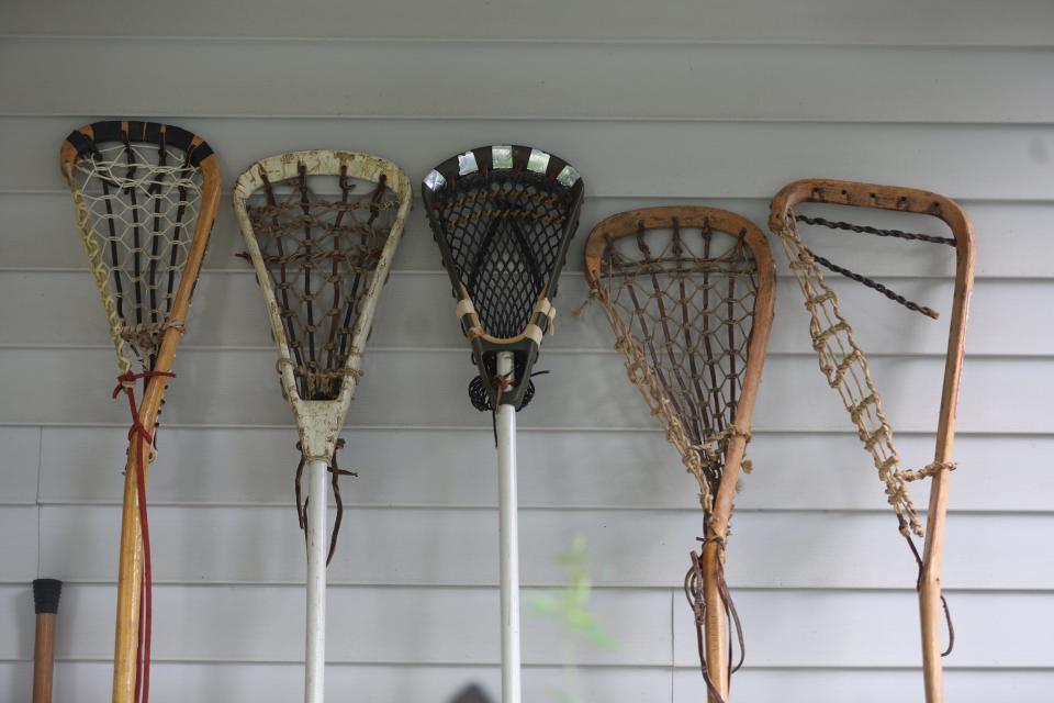 Gary Henry ’s collection includes lacrosse sticks from the 1970s and 1980s. The one on the far left is from the 1980s.