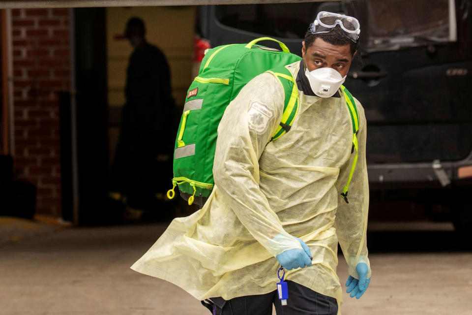 An Emergency Medical Technician (EMT) wearing personal protective equipment (PPE) walks out of the Cobble Hill Health Center nursing home during the ongoing outbreak of the coronavirus disease (COVID-19) in the Brooklyn borough of New York, U.S., April 17, 2020. REUTERS/Lucas Jackson     TPX IMAGES OF THE DAY