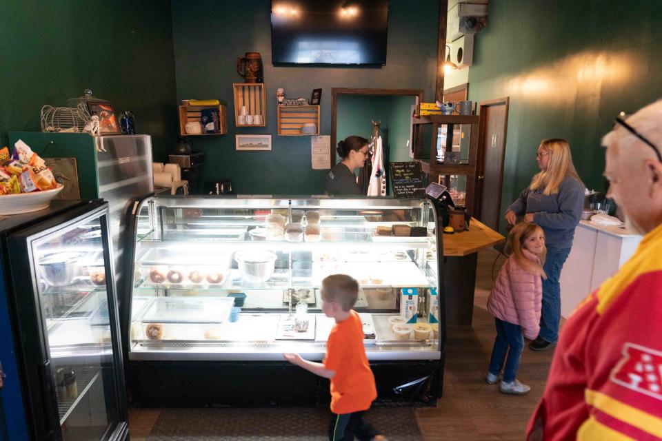 Counters and cabinets with bagels, pies, muffins and cookies surround Heather Williams, owner of The Forgotten Grain Bakery & Bistro in Auburn, as customers come in.