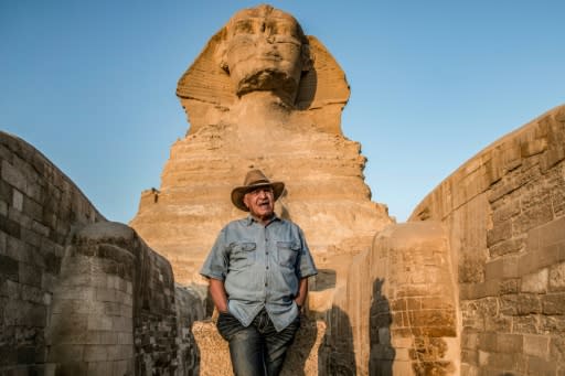 Egyptian archaeologist and former antiquities minister Zahi Hawass stands in front the Great Sphinx of Giza during a lecture with a group of tourists