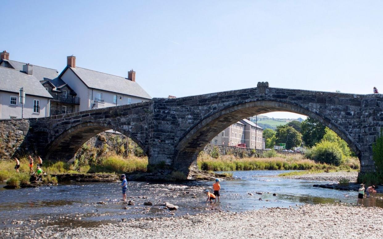 Children playing under the roman bridge in Llanwrst