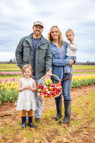 <p>Robbie Caponetto</p> Gather Together: Seth and Kaylee Hubert enjoy picking flowers with their two children, Addie and Atlas.