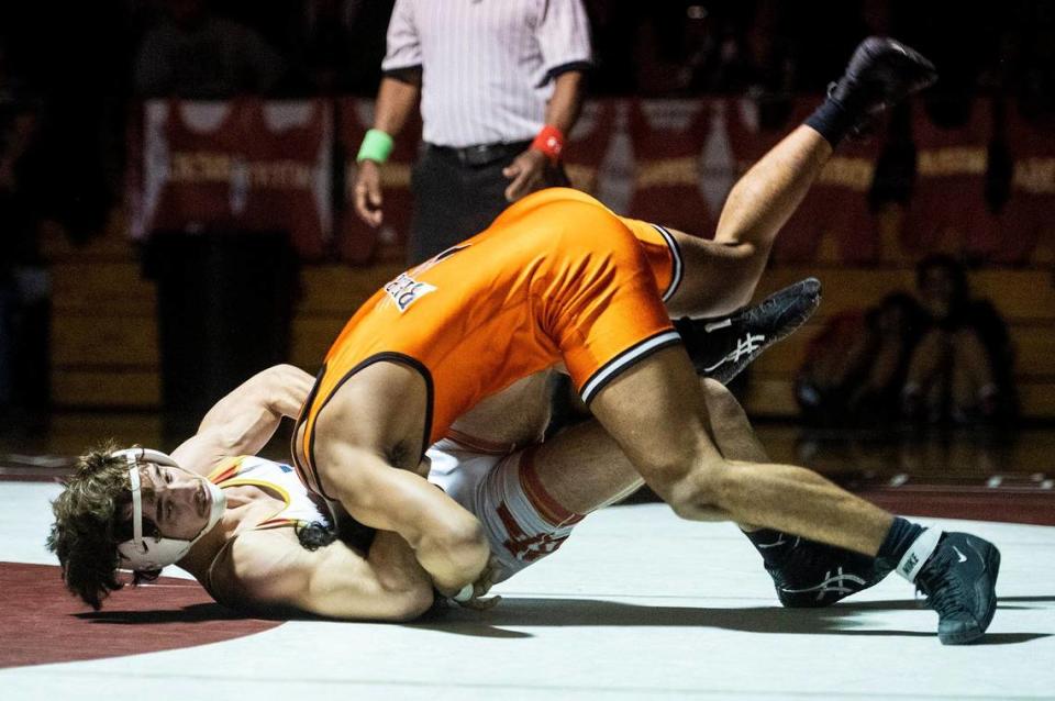 Golden Valley’s Jayden Richards wrestles Merced’s Angel Valenzuela during a match at Golden Valley High School in Merced, Calif., on Tuesday, Jan. 23, 2024.