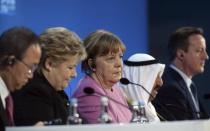 German Chancellor Angela Merkel (C) listens to speakers at the donors Conference for Syria in London, Britain February 4, 2016. REUTERS/Stefan Rousseau/pool