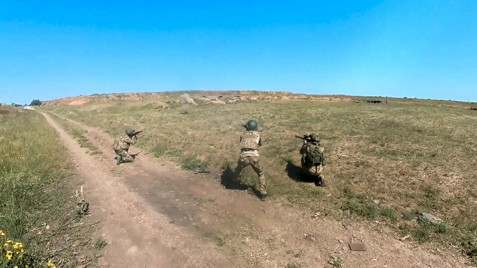 In this photo, taken from video released by the Russian Defense Ministry Press Service on Monday, July 1, 2024, Russian soldiers shoot toward an Ukrainian positions in an undisclosed location in Ukraine. (Russian Defense Ministry Press Service via AP, File)