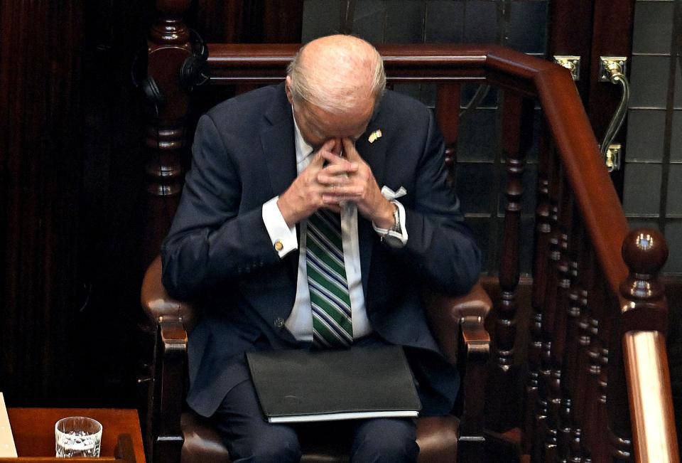 Biden prays after delivering his speech to the Dail (AFP/Getty)
