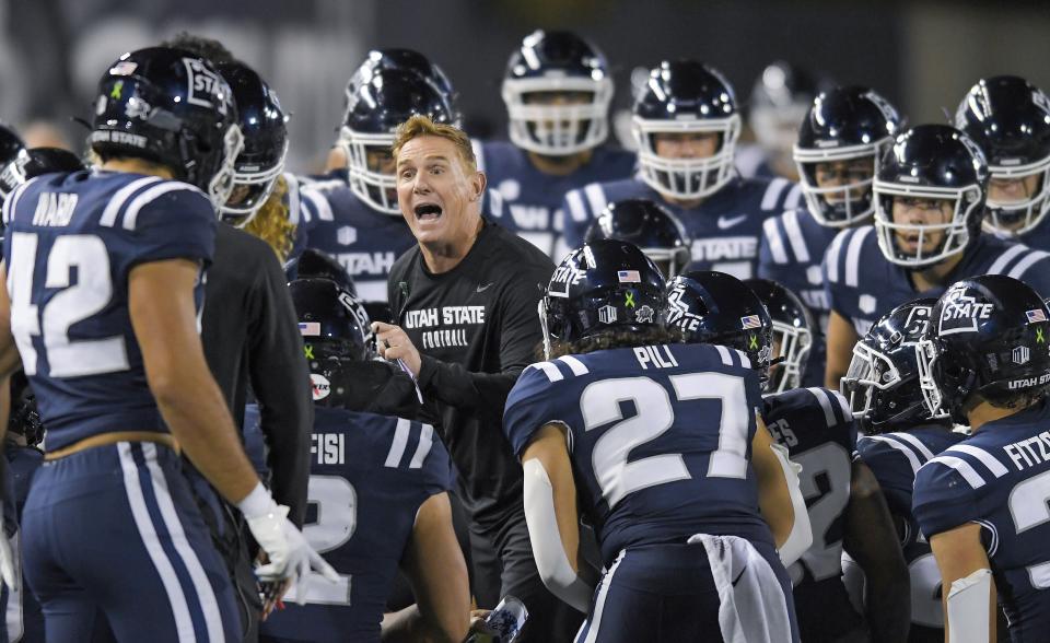 Utah State coach Blake Anderson talks to players during a timeout against Colorado State on Saturday, Oct. 7, 2023, in Logan, Utah. The Aggies prevailed and host Fresno State Friday night. | The Herald Journal via Associated Press
