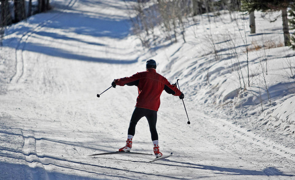 FILE - This Feb. 3, 2009 file photo shows a cross-country skier in Medicine Bow National Forest's Tie City in Albany County, Wyo. There are also plenty of free ways to experience the backcountry wilderness in every season, from warm-weather hikes in the vast Medicine Bow National Forest to snowshoeing and cross-country skiing followed by a soak in a hot spring as snow falls. (AP Photo/Laramie Boomerang, Andy Carpenean, File)