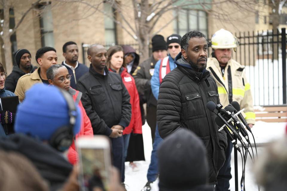Minneapolis City Councilman Abdi Warsame addresses the media outside the building at 630 Cedar Avenue where an early morning fire killed multiple people Wednesday, Nov. 27, 2019 in Minneapolis. Residents of the high rise were evacuated early Wednesday after a fire broke out on the 14th floor of the building. (Aaron Lavinsky/Star Tribune via AP)