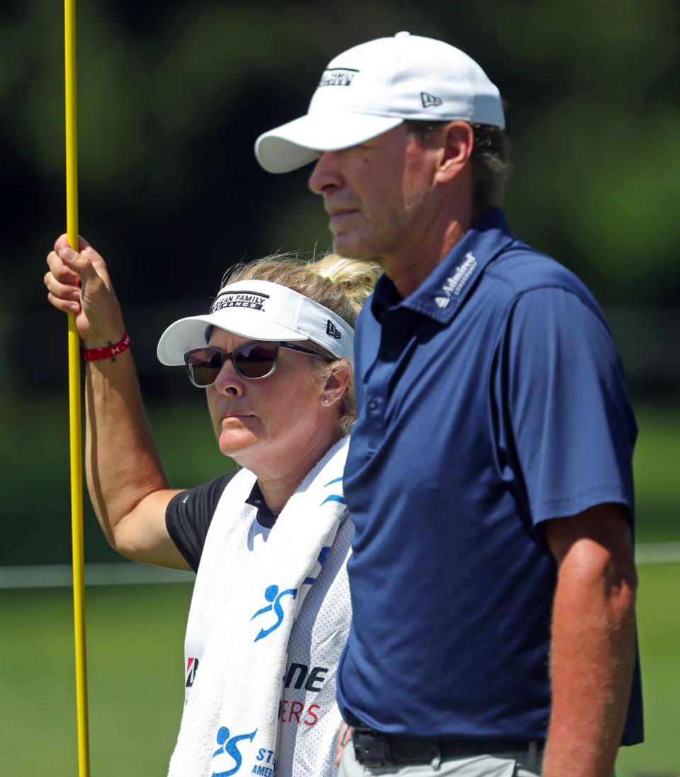 Nicki Stricker caddies for her husband Steve Stricker during the first round of the Bridgestone Senior Players Championship at Firestone Country Club on Thursday, June 24, 2021, in Akron, Ohio.