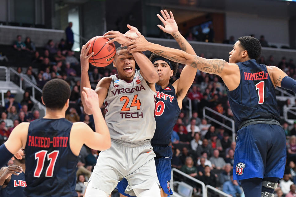 <p>Kerry Blackshear Jr. #24 of the Virginia Tech Hokies fights for possession against the Liberty Flames in the second round of the 2019 NCAA Men’s Basketball Tournament held at SAP Center on March 24, 2019 in San Jose, California. (Photo by Justin Tafoya/NCAA Photos via Getty Images) </p>