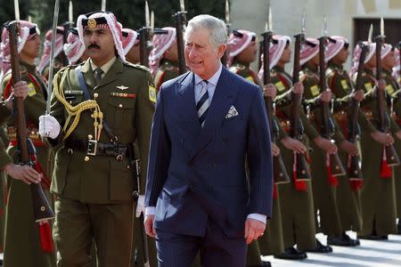 Britain's Prince Charles (R) reviews an honour guard before a meeting with Jordan's King Abdullah at the Royal Palace in Amman February 8, 2015. REUTERS/Muhammad Hamed