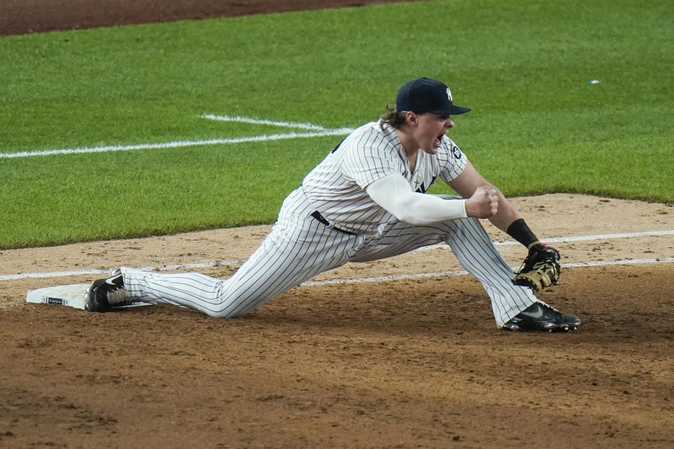 CORRECTS TO TRIPLE PLAY, INSTEAD OF DOUBLE PLAY - New York Yankees' Luke Voit celebrates after Chicago White Sox's Andrew Vaughn was thrown out at first base to complete a triple play during the ninth inning of a baseball game Friday, May 21, 2021, in New York. (AP Photo/Frank Franklin II)