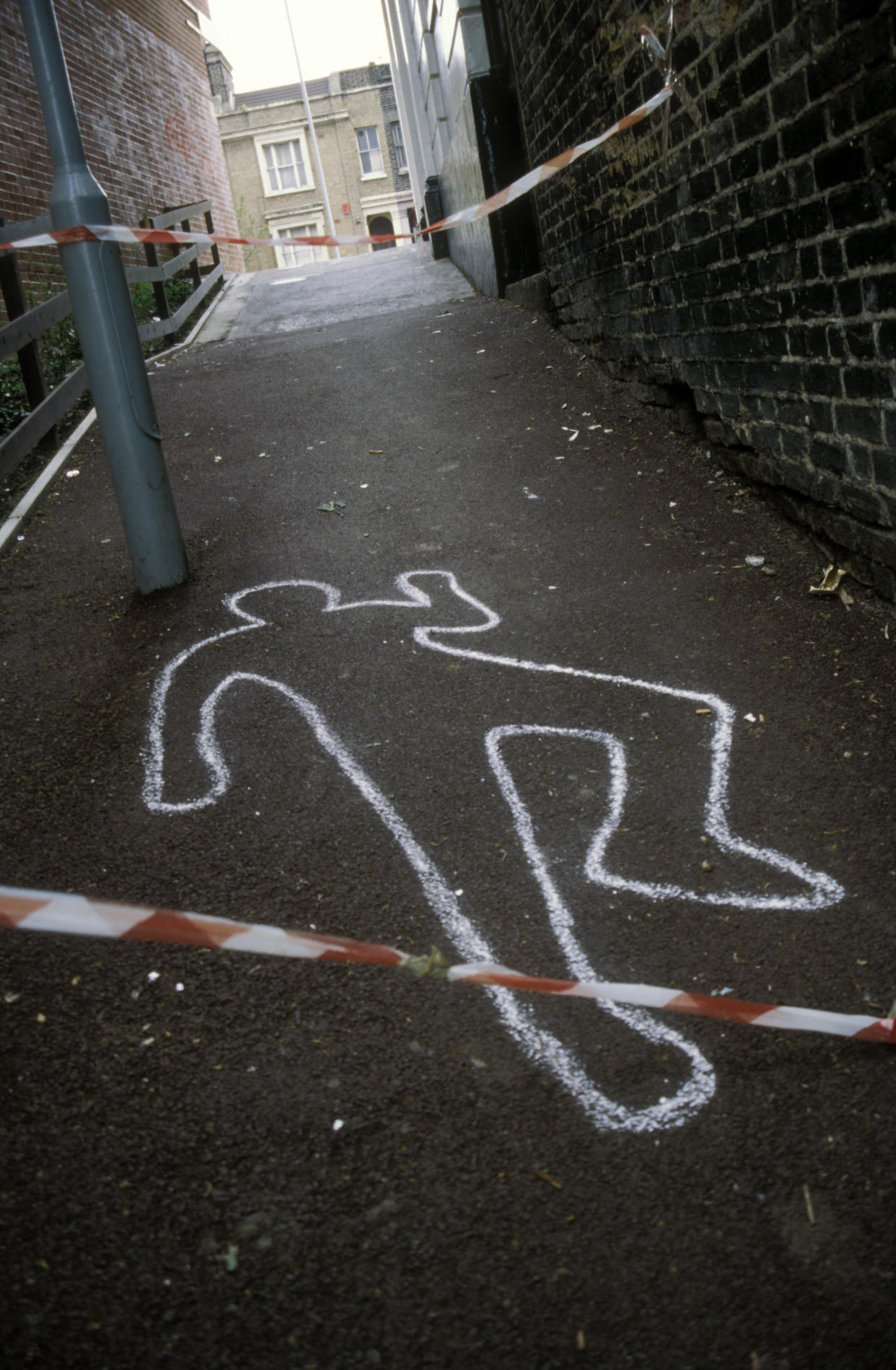 The police chalk outline of a murder victim (Photo by: Photofusion/UIG via Getty Images)