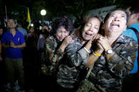 People weep after an announcement that Thailand's King Bhumibol Adulyadej has died, at the Siriraj hospital in Bangkok, Thailand, October 13, 2016. REUTERS/Chaiwat Subprasom