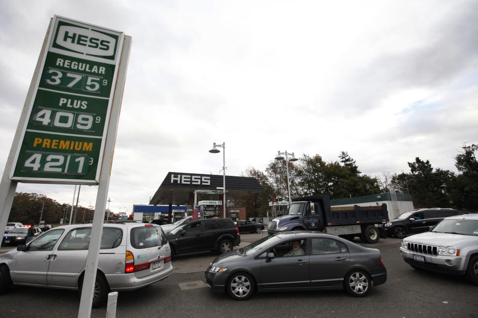 Motorists flock to a working gas station in the aftermath of superstorm Sandy, Wednesday, Oct. 31, 2012, in Rockville Center, N.Y. Travel in the Northeast creaked back into motion on Wednesday, a grinding, patchy recovery that made it clear that stranded travelers will struggle to get around for days to come. (AP Photo/Jason DeCrow)