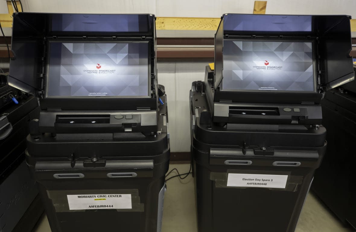 FILE – Dominion Voting ballot-counting machines are shown at a Torrance County warehouse during election equipment testing with local candidates and partisan officers in Estancia, N.M., Sept. 29, 2022. Documents in defamation lawsuit illustrate pressures faced by Fox News journalists in the weeks after the 2020 presidential election. The network was on a collision course between giving its conservative audience what it wanted and reporting uncomfortable truths about then-President Donald Trump and his false fraud claims.(AP Photo/Andres Leighton, File)