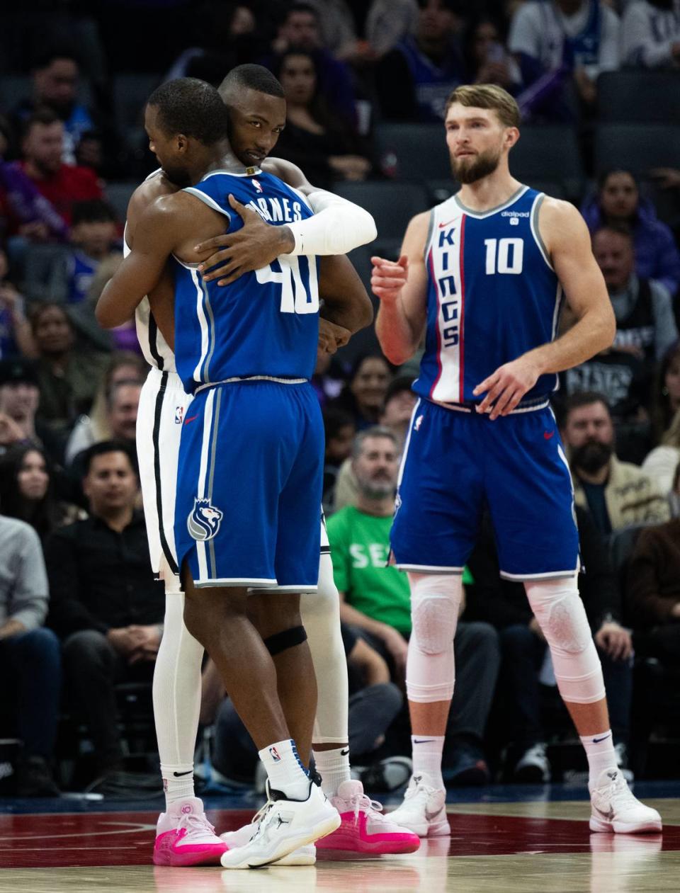 Brooklyn Nets forward Harry Giles III hugs Sacramento Kings forward Harrison Barnes (40) as he enters the game at Golden 1 Center on Monday.