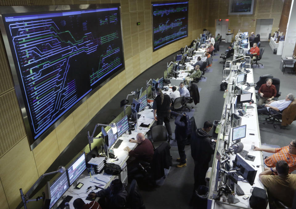 Workers keep an eye on train traffic coming and going from grand Central Terminal from a master control room high atop the building in New York, Tuesday, Jan. 8, 2013. Grand Central terminal celebrates its 10th anniversary on Feb. 1. (AP Photo/Kathy Willens)