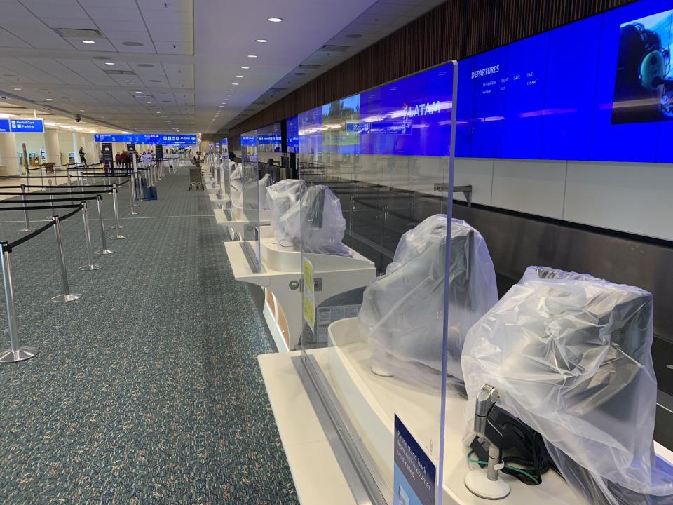 Sensitive electronic equipment is covered at Orlando International Airport as they prepare to cease commercial operations with Hurricane Nicole approaching.