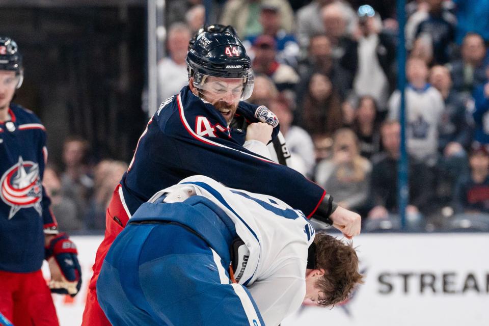 Dec 29, 2023; Columbus, Ohio, USA;
Columbus Blue Jackets defenseman Erik Gudbranson (44) fights with Toronto Maple Leafs defenseman Simon Benoit (2) during the second period of their game on Friday, Dec. 29, 2023 at Nationwide Arena.