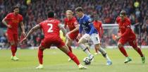 Britain Soccer Football - Liverpool v Everton - Premier League - Anfield - 1/4/17 Everton's Ross Barkley in action with Liverpool's Lucas Leiva (C), Nathaniel Clyne and Roberto Firmino (R) Action Images via Reuters / Carl Recine Livepic