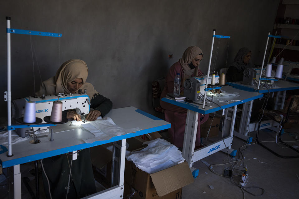 Palestinian women sew diapers in Rafah, southern Gaza Strip, Thursday, Feb. 15, 2024. Palestinians in Gaza have experienced severe shortages of basic necessities since the war began on Oct. 7. (AP Photo/Fatima Shbair)