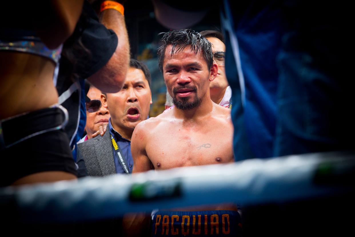 Manny Pacquiao says there have been talks to make a fight with UFC lightweight champion Conor McGregor, but both Top Rank chairman Bob Arum and UFC president Dana White deny it. (Getty Images)