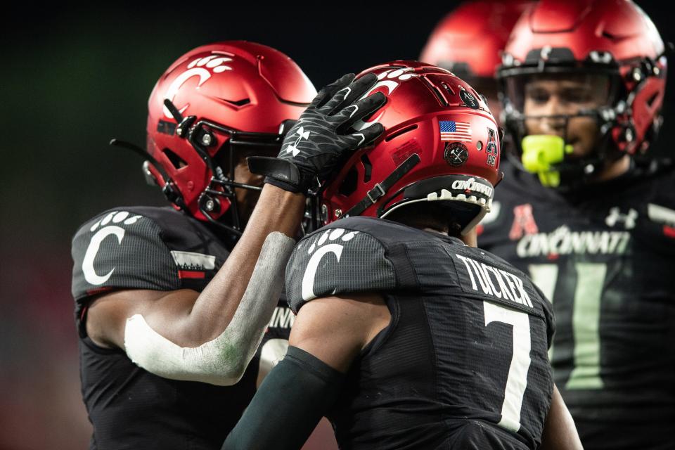 Cincinnati receiver Tre Tucker (7) celebrates his first-half touchdown against South Florida.