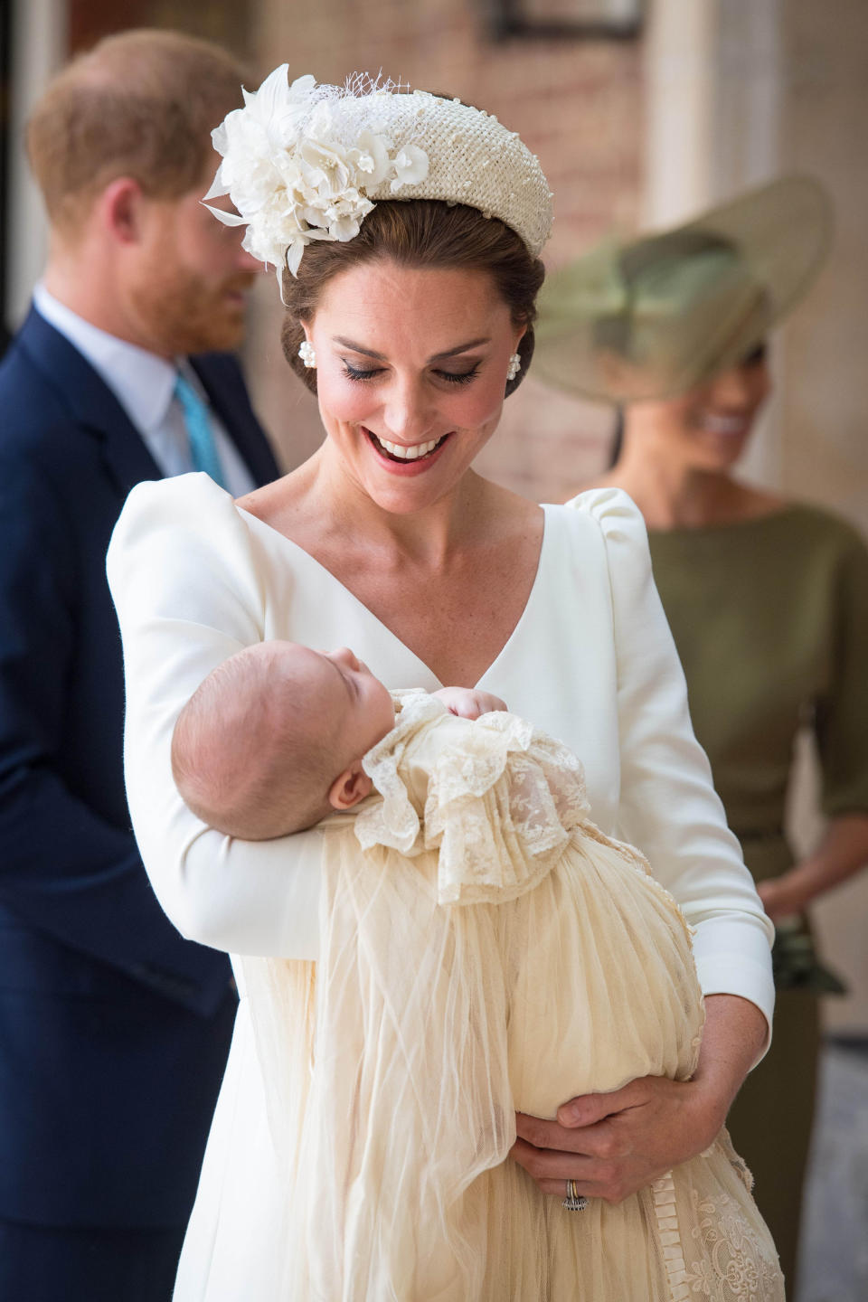 The Duchess of Cambridge carries Prince Louis as they arrive for his christening service at the Chapel Royal, St James's Palace, London.